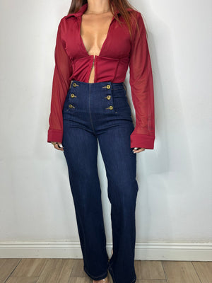 JEANS CON BOTTONI DORATI