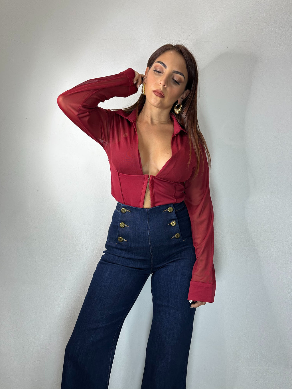 JEANS CON BOTTONI DORATI