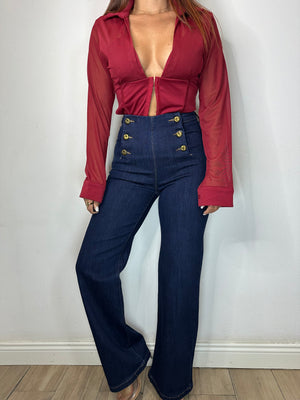 JEANS CON BOTTONI DORATI