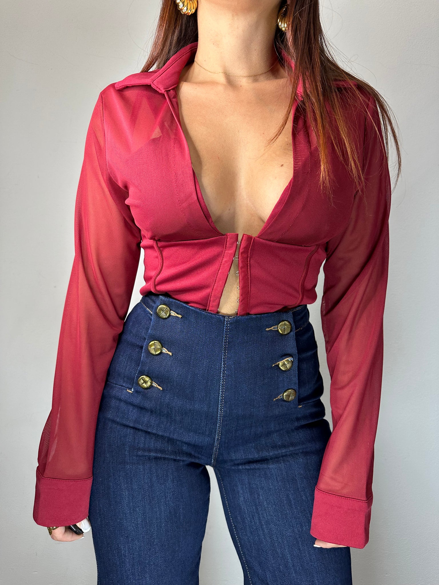 JEANS CON BOTTONI DORATI